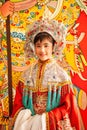 Adorable face of a chinese opera actress in beautiful traditional costume, smiling at camera, colorful of traditional chinese